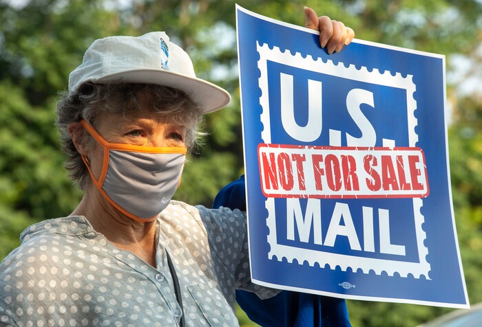 (Rick Egan  |  The Salt Lake Tribune)     Heather Dorrell gathers with other protesters during a rally to "Save the Post Office," hosted by Alliance for a Better Utah, NAACP Salt Lake Branch, League of Women Voters at the Post Office on 200 South in Salt Lake City, Saturday, Aug. 22, 2020.
