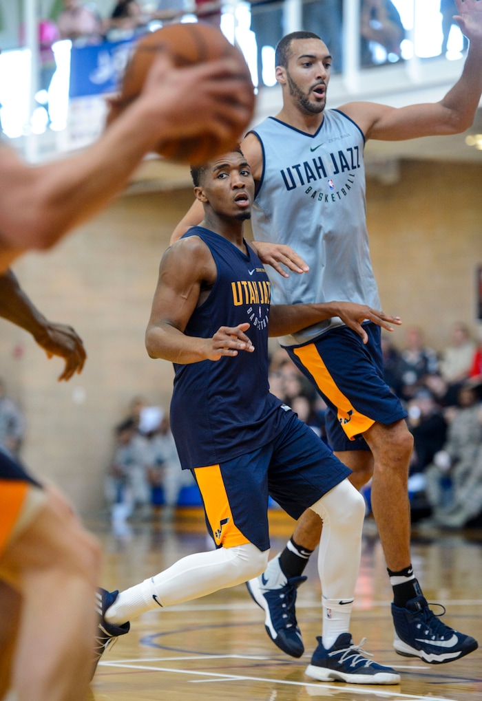 (Steve Griffin  |  The Salt Lake Tribune)    Utah Jazz guard  Donovan Mitchell  puts a body on Rudy Gobert as the Jazz scrimmage in the Warrior Fitness Center on Hill Air Force Base as a part of a "Hoops for Troops" promotion Ogden Friday September 29, 2017. It's also Utah's first public scrimmage of the season, and the first look at how the new pieces of the team will work together. 