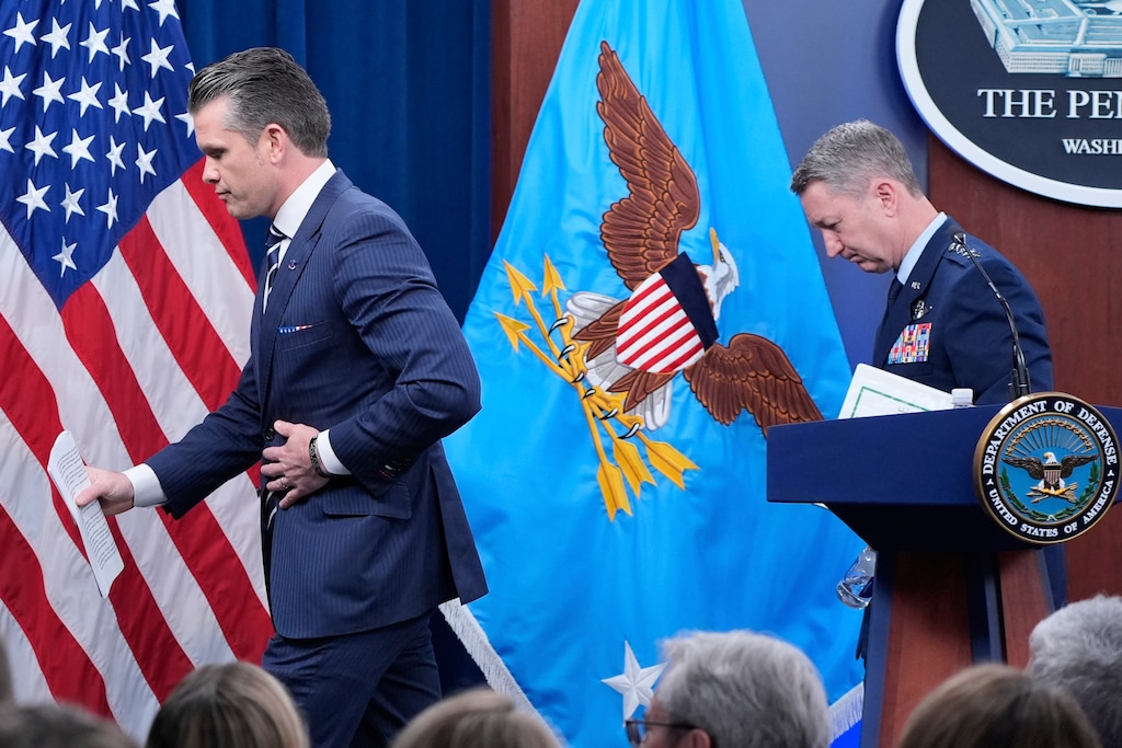 Defense Secretary Pete Hegseth and Joint Chiefs Chairman Gen. Dan Caine depart at the end of a news conference at the Pentagon in Washington, Sunday, June 22, 2025, after the U.S. military struck three sites in Iran, directly joining Israel's effort to destroy the country's nuclear program. (AP Photo/Alex Brandon)