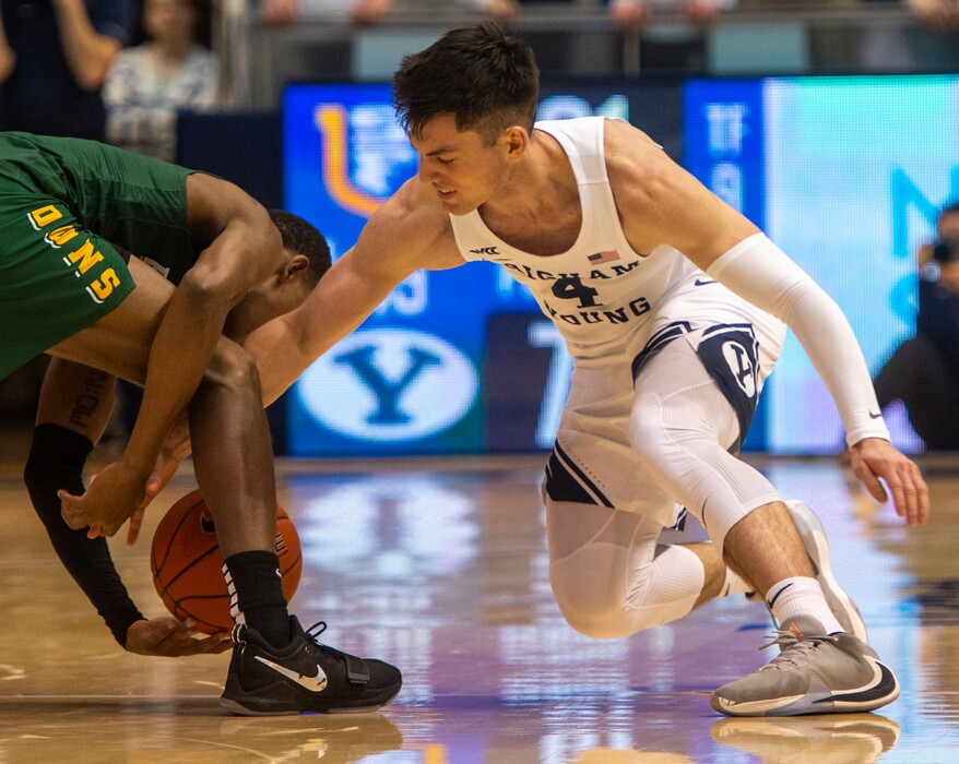 (Rick Egan  |  The Salt Lake Tribune)    Brigham Young Cougars guard Alex Barcello (4) goes for a loose ball along with San Francisco Dons guard Jamaree Bouyea (1), in WCC basketball acton between the Brigham Young Cougars and the San Francisco Dons, at the Marriott Center, Saturday, Feb. 8, 2020.