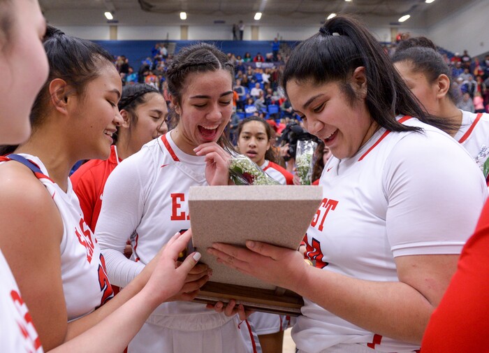 (Leah Hogsten  |  The Salt Lake Tribune) East's Lynda Mahe (20), East's Liana KaituÕu (23) and East's Lani Taliauli (54) celebrate the win.  East defeated Timpview 68-48 to win the the 5A High School Girls' Basketball Tournament title at SLCC in Taylorsville, Saturday, Feb. 24, 2018. 