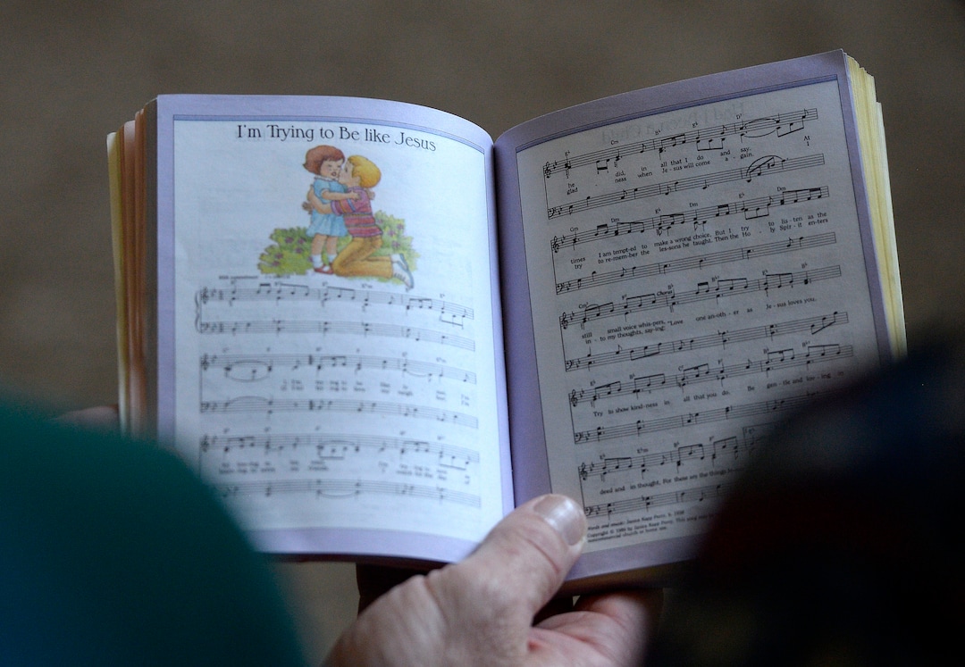 (Al Hartmann  |  The Salt Lake Tribune)
Believers in Denver Snuffer's Remnant movement gather in a Sandy home for a fellowship meeting Sunday, Aug. 13, to sing songs and partake of the sacrament.