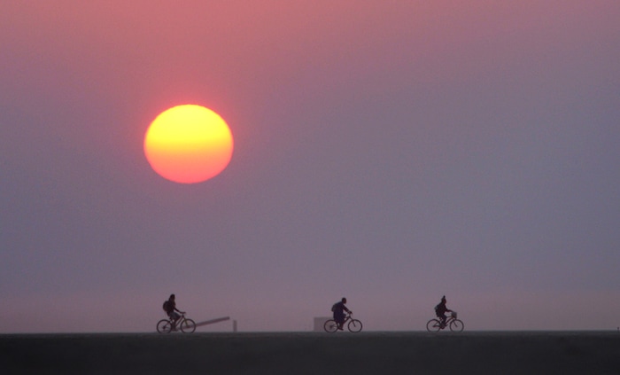 (Rick Egan  |  The Salt Lake Tribune)The sun rises over the Black Rock Desert during the Burning Man Festival, Friday, September 1, 2017.