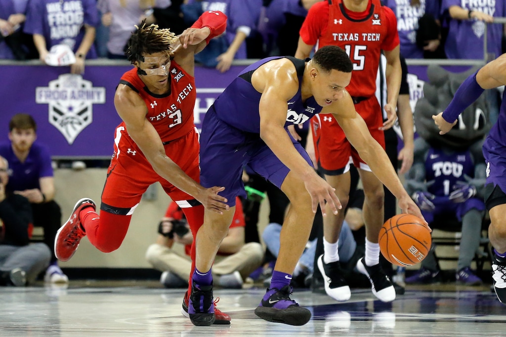 TCU guard Desmond Bane, center, makes the steal on Texas Tech guard Jahmi'us Ramsey, left, during the second half of an NCAA college basketball game in Fort Worth, Texas, Tuesday, Jan. 21, 2020. TCU won 65-54. (AP Photo/Ray Carlin)