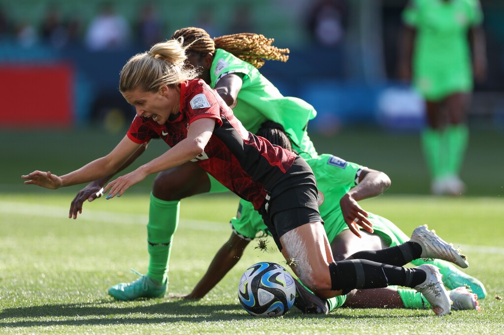 (Victoria Adkins | AP) Canada's Cloe Lacasse falls after colliding with Nigeria's Michelle Alozie, right, and Nigeria's Christy Ucheibe, back, during the Women's World Cup Group B soccer match between Nigeria and Canada in Melbourne, Australia, Friday, July 21, 2023.