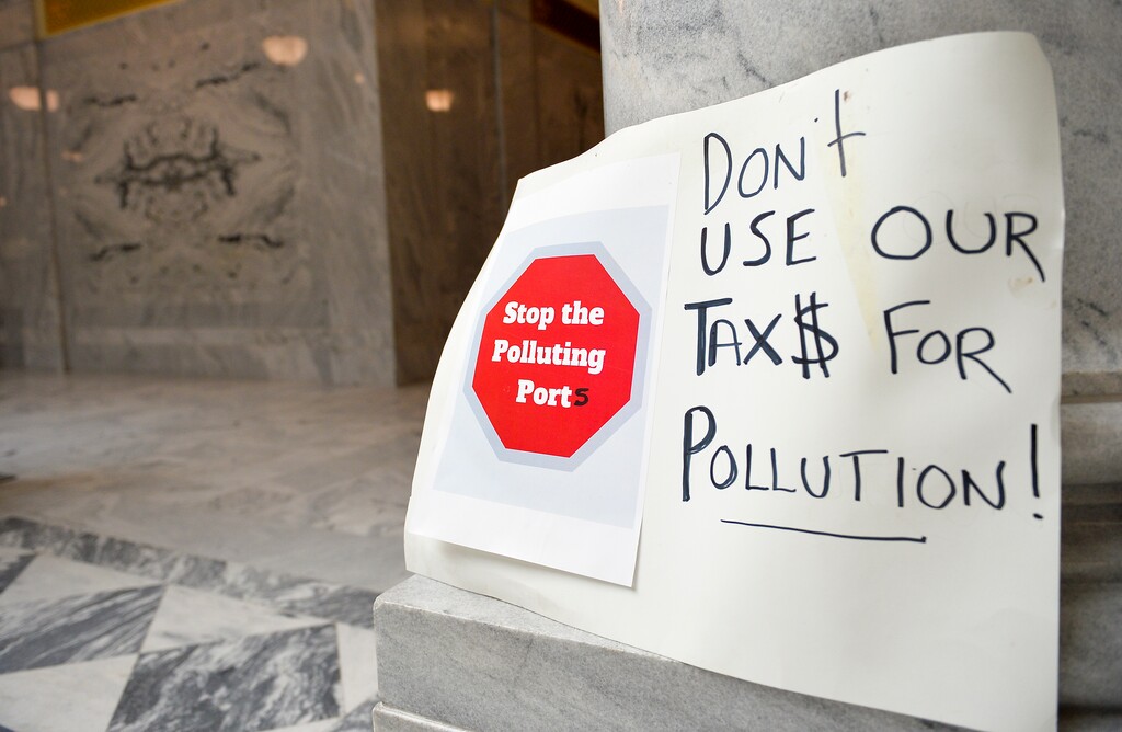 (Chris Samuels | The Salt Lake Tribune) A sign in opposition to the Utah Inland Port Authority are seen on the floor of the State Capitol before a meeting of the port’s board, Thursday, May 11, 2023.
