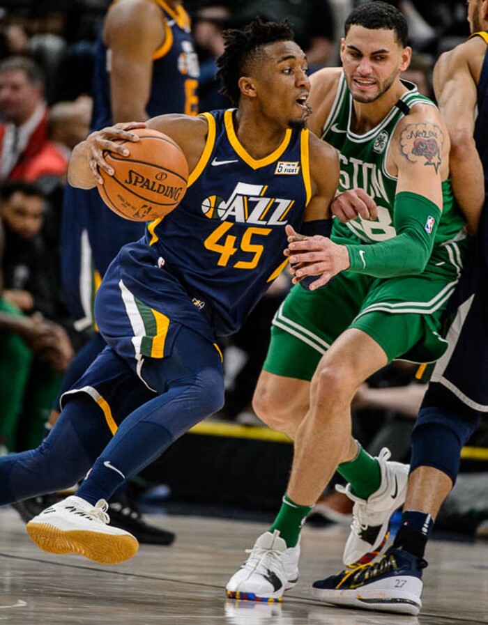 (Trent Nelson | The Salt Lake Tribune)  
Utah Jazz vs. Boston Celtics, NBA basketball in Salt Lake City, Wednesday March 28, 2018. Utah Jazz guard Donovan Mitchell (45) drives on Boston Celtics forward Abdel Nader (28).