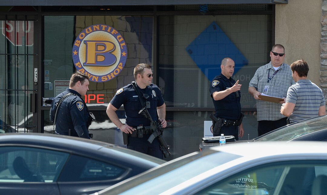 (Francisco Kjolseth  |  The Salt Lake Tribune)  Police work the scene of a shooting at Pawn and Sales, 135 S. and 500 West, in Bountiful on Friday, May 4, 2018, where two men attempted to rob the store. One suspect was killed in a "scuffle" with a staff member while the other one fled the scene.