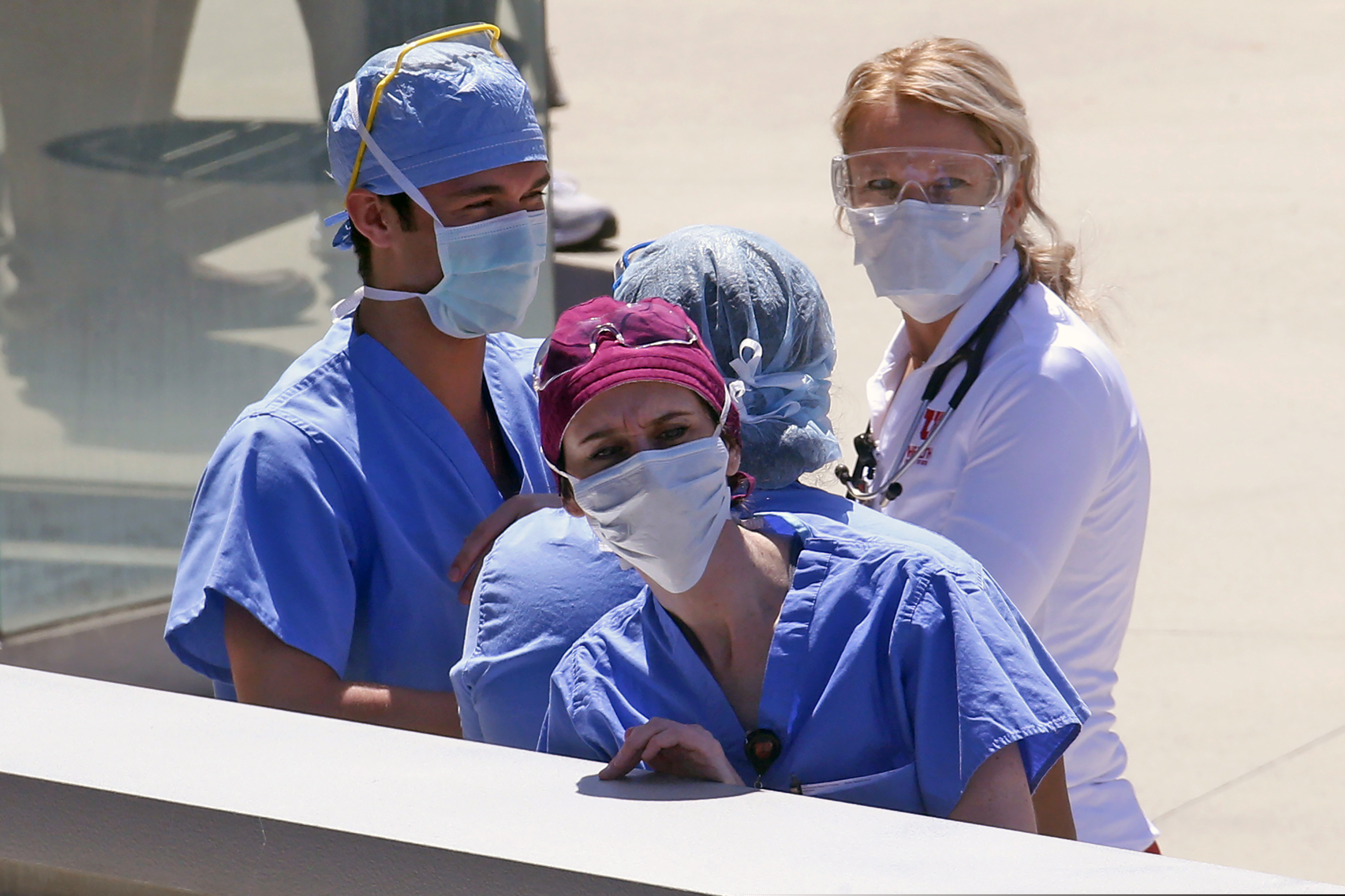 (Rick Bowmer | AP photo)

In this April 30, 2020, photo, health care workers look on during a flyover at the University of Utah Hospital in Salt Lake City.