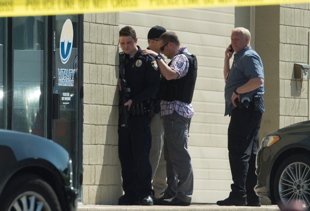 (Rick Egan | The Salt Lake Tribune) Bountiful police investigate after they say a store clerk shot an armed robbery suspect at Bountiful Pawn and Sales on Thursday, May 3, 2018. Police are looking for a second suspect in the attempted armed robbery.