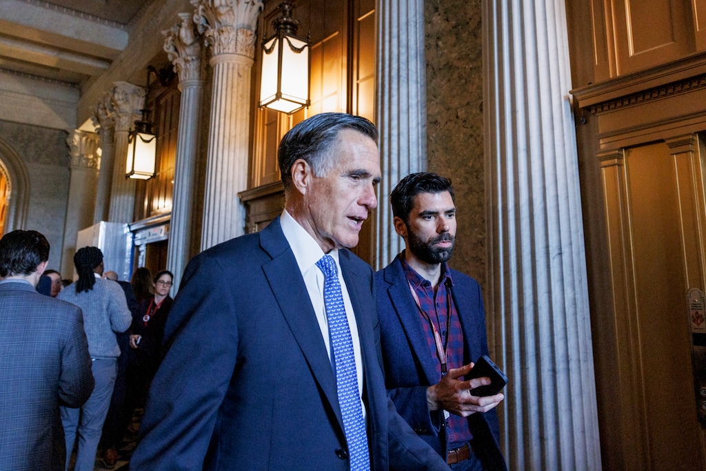 (Anna Rose Layden | The New York Times) Sen. Mitt Romney speaks to members of the media at the U.S. Capitol in Washington, on Feb. 8, 2024. Party leaders, national security institutionalists and centrists make up the 18 Republicans who have joined Democrats in breaking filibusters against the military aid, defying former President Donald Trump.