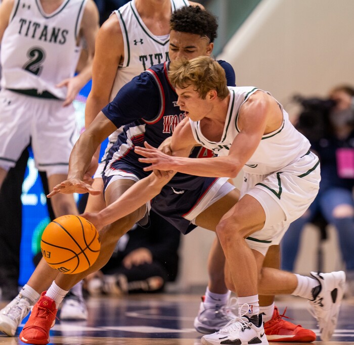 (Rick Egan | The Salt Lake Tribune) 
Woods Cross, forward, Mason Bendinger (24) goes for a loose ball along with Olympus guard Luke Lowe (3), in the 5A State Championship game between Woods Cross and Olympus, at the Marriott Center in Provo, on Saturday, March 5, 2022. 