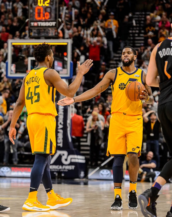 (Trent Nelson | The Salt Lake Tribune)  Utah Jazz guard Donovan Mitchell (45) and Utah Jazz forward Royce O'Neale (23) celebrate as time runs out as the Utah Jazz host the Phoenix Suns, NBA basketball in Salt Lake City, Wednesday Feb. 14, 2018.