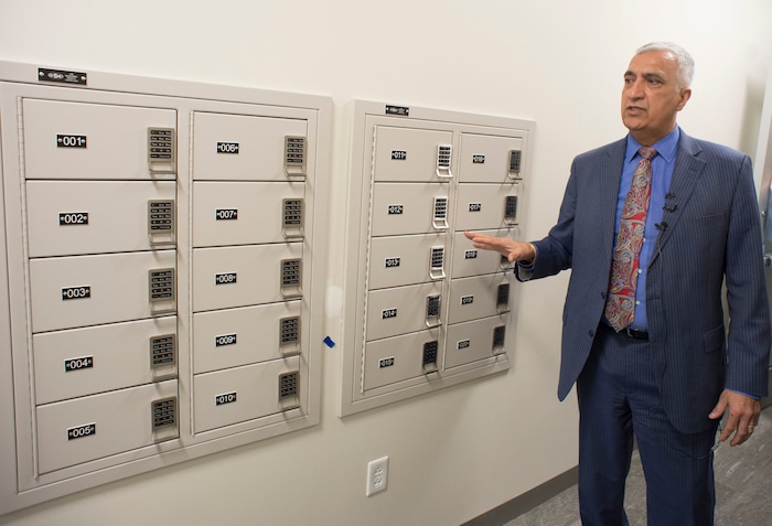 (Rick Egan  |  The Salt Lake Tribune)    Sim Gill, Salt Lake County District Attorney, shows the lock boxes for guns, as he gives a tour of the 5th floor of the new Salt Lake County District Attorney building in Salt Lake City, Friday, March 9, 2018.



