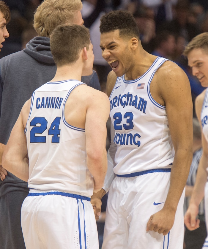(Rick Egan  |  The Salt Lake Tribune)  Brigham Young Cougars Brigham Young Cougars guard McKay Cannon (24) and Brigham Young Cougars forward Yoeli Childs (23) celebrate their win over the San Francisco Dons in overtime, in basketball action at the Marriott Center, Saturday, February 10, 2018.