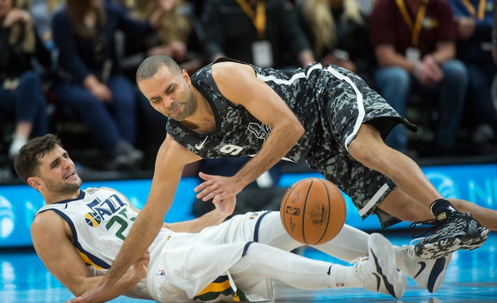 (Rick Egan  |  The Salt Lake Tribune)  Utah Jazz guard Raul Neto (25) is called for a foul as he collides with San Antonio Spurs guard Tony Parker (9) in NBA action, in Salt Lake City, Monday, February 12, 2018.