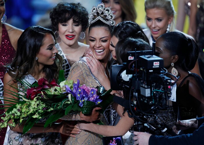 (John Locher | The Associated Press) The new Miss Universe Demi-Leigh Nel-Peters, center, cries after winning at the Miss Universe pageant Sunday, Nov. 26, 2017, in Las Vegas.