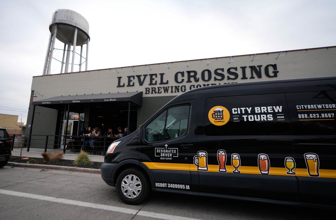 (Francisco Kjolseth | The Salt Lake Tribune) The City Brew Tours in Salt Lake makes the second of four stops at Level Crossing Brewery on Saturday, April 30, 2022. The new educational beer tour takes folks around to local breweries to see the back end brewing process, sample beers and pair them with food. 