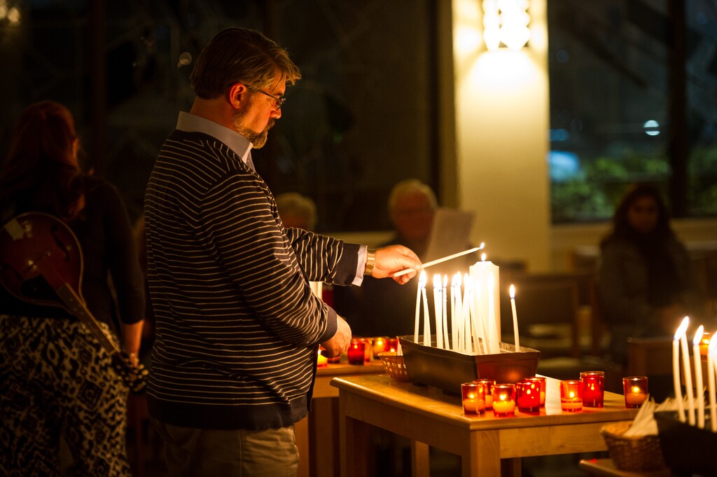 (Alex Gallivan  |  Special to the Tribune)  Rev. Curtis Price, First Baptist Church lights a candle at the nationwide vigil to end gun violence prior to this week's 5th anniversary of the Sandy Hook Elementary School shooting at All Saints Episcopal Church in Salt Lake City, Sunday, December 10.