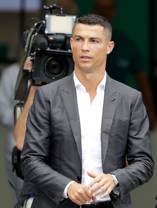 Portuguese ace Ronaldo arrives to undergo medical checks at the Juventus stadium in Turin, Italy, Monday, July 16, 2018. (AP Photo/Luca Bruno)