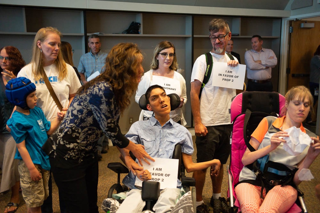 (Trent Nelson | The Salt Lake Tribune)  Protestors at a news conference where a coalition including the LDS Church came out against Utah's medical marijuana initiative, in Salt Lake City on Thursday Aug. 23, 2018.