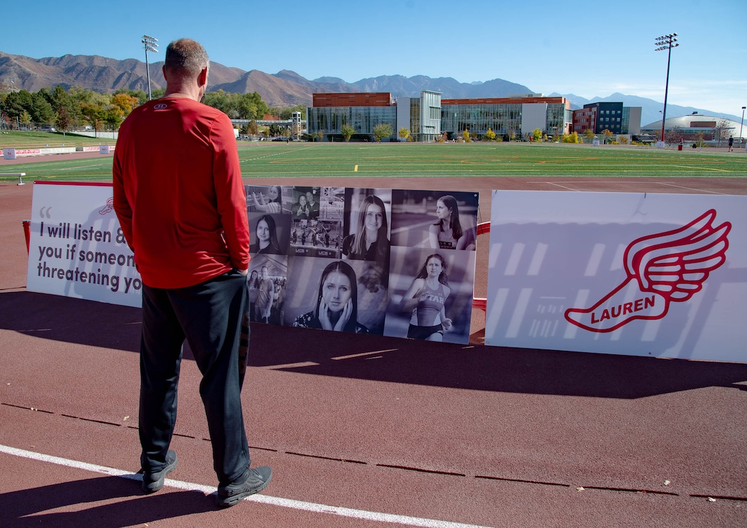 (Francisco Kjolseth  |  The Salt Lake Tribune) University of Utah basketball coach Larry Krystkowiak, stands in silence as he acknowledges a banner honoring student and track athlete Lauren McCluskey on Thursday, Oct. 22, 2020, on the two-year anniversary of her murder.