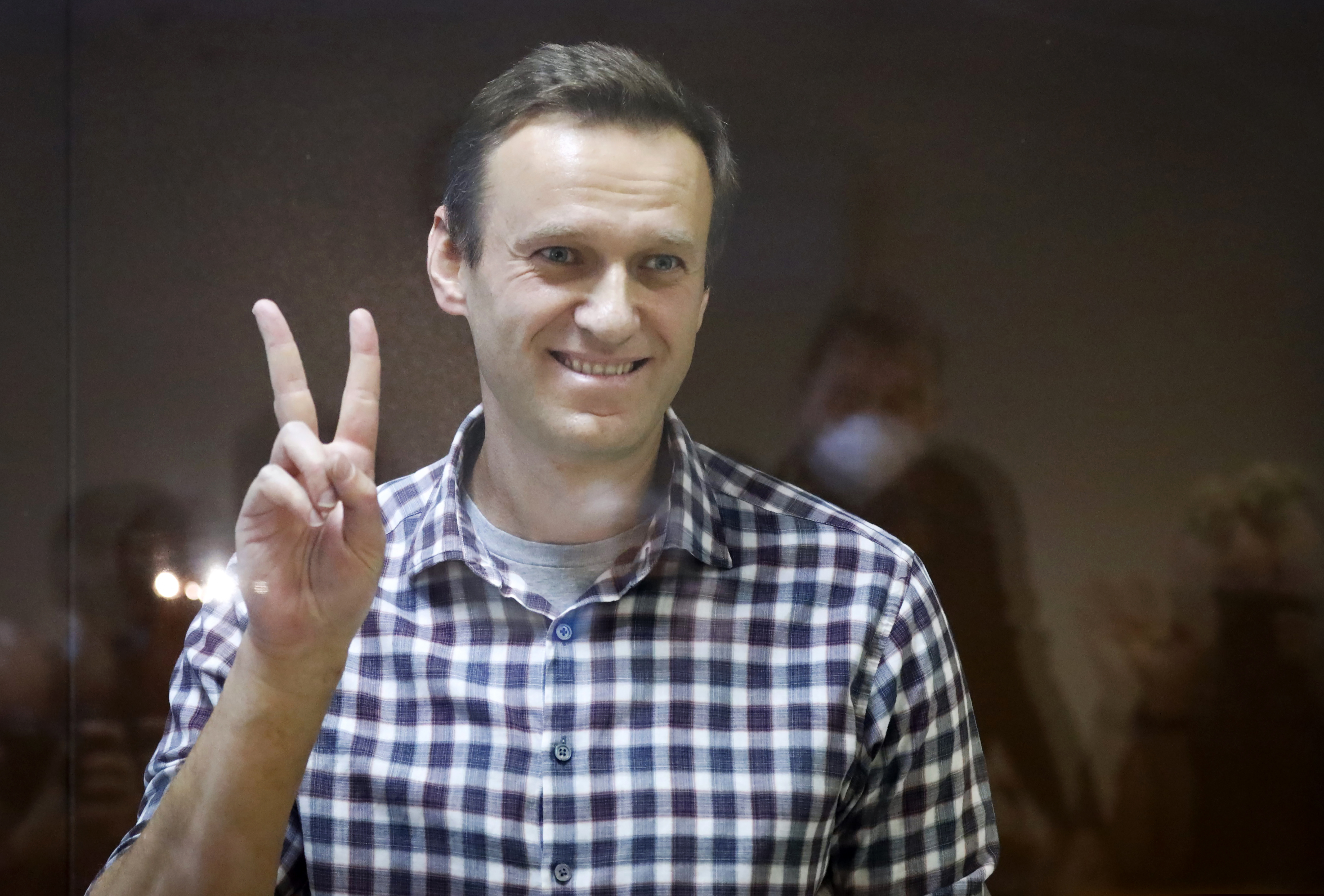 (Alexander Zemlianichenko | AP photo)

Russian opposition leader Alexei Navalny gestures as he stands in a cage in the Babuskinsky District Court in Moscow, Russia, Saturday, Feb. 20, 2021.