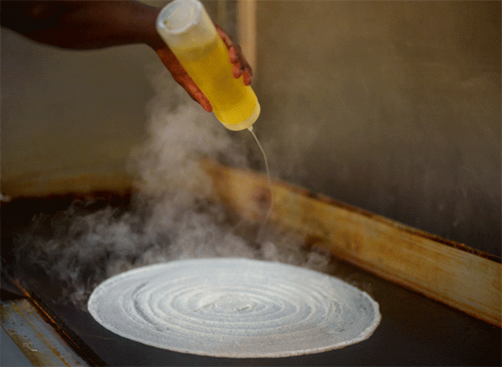 (Trent Nelson  |  The Salt Lake Tribune) Kesavan Rajendran prepares a dosa at SV Cafe, a South Indian, all-vegetarian restaurant in West Jordan on Friday, Aug. 15, 2025.