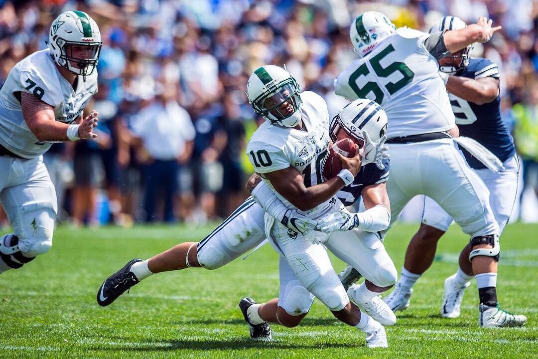 (Chris Detrick  |  The Salt Lake Tribune)  Brigham Young Cougars defensive lineman Sione Takitaki (16) sacks Portland State Vikings quarterback Jalani Eason (10) during the game at LaVell Edwards Stadium Saturday, August 26, 2017.