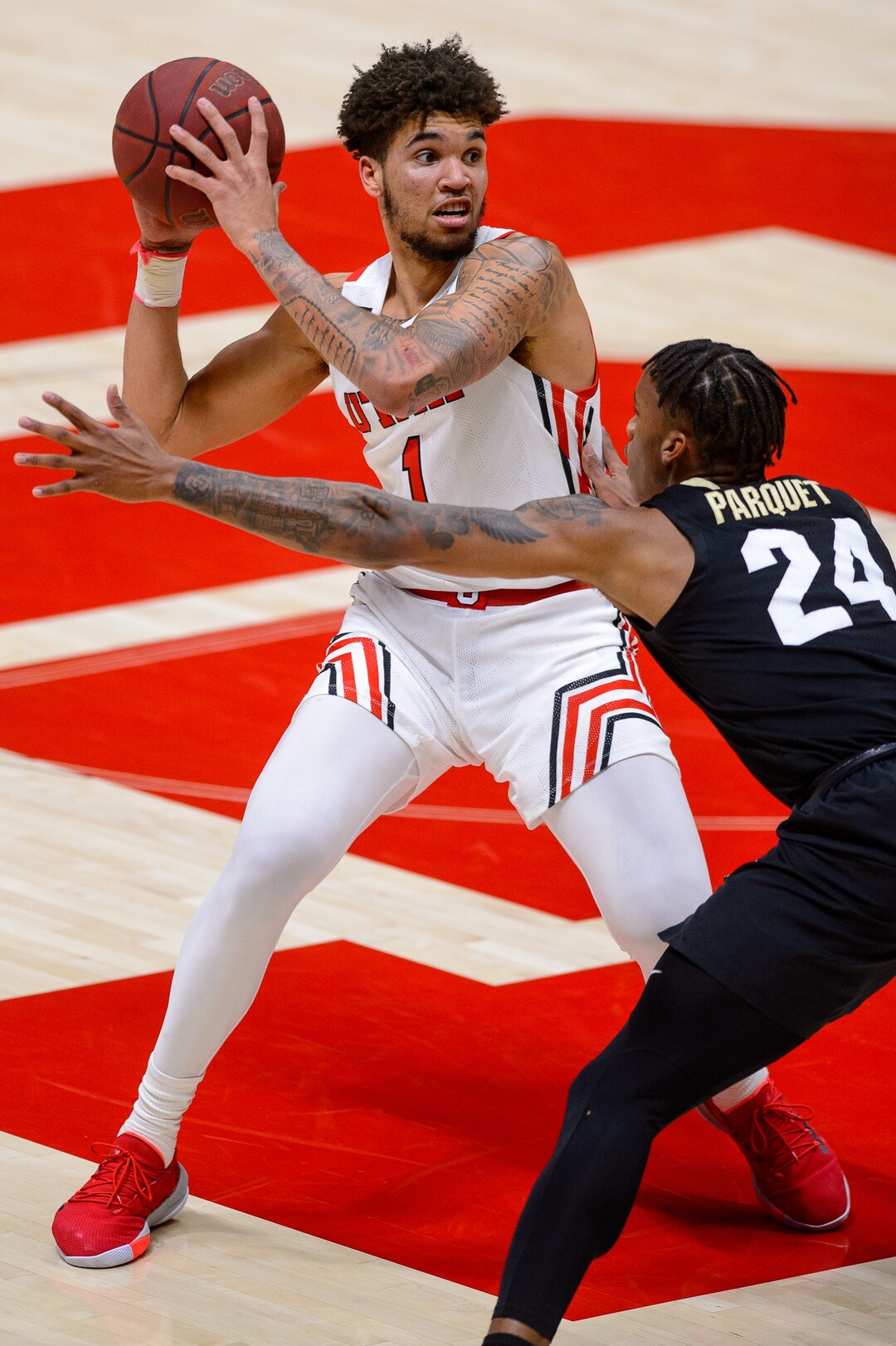 (Trent Nelson  |  The Salt Lake Tribune) Utah Utes forward Timmy Allen (1) defended by Colorado Buffaloes guard Eli Parquet (24) as Utah hosts Colorado, NCAA basketball in Salt Lake City on Monday, Jan. 11, 2021.