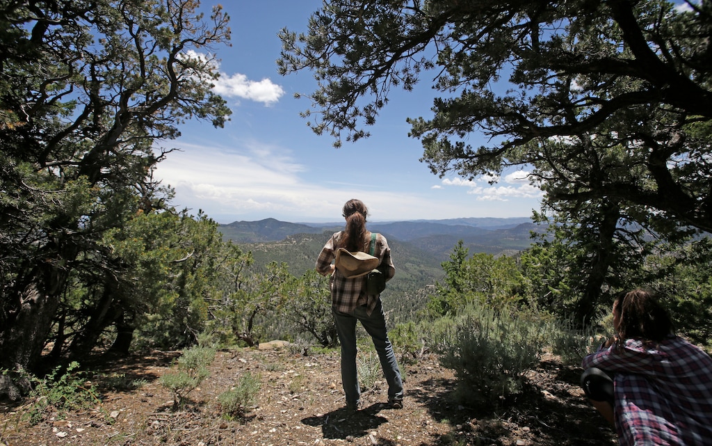 (Rick Bowmer | AP file photo) In this July 13, 2015, file photo, Melanie Martin of the Tar Sands Resistance Movement, looks over the Book Cliffs, in eastern Utah. Development of the country's first tar sands mine is one of a number of battle fronts across the West between preservationists and the energy industry.