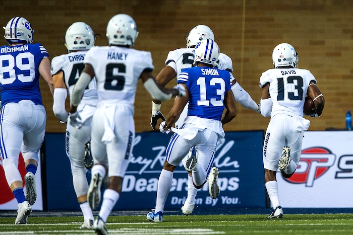 (Chris Detrick  |  The Salt Lake Tribune)  Utah State Aggies cornerback Jalen Davis (13) scores a touchdown off of an interception during the game at Merlin Olsen Field at Maverik Stadium Friday, September 29, 2017.
