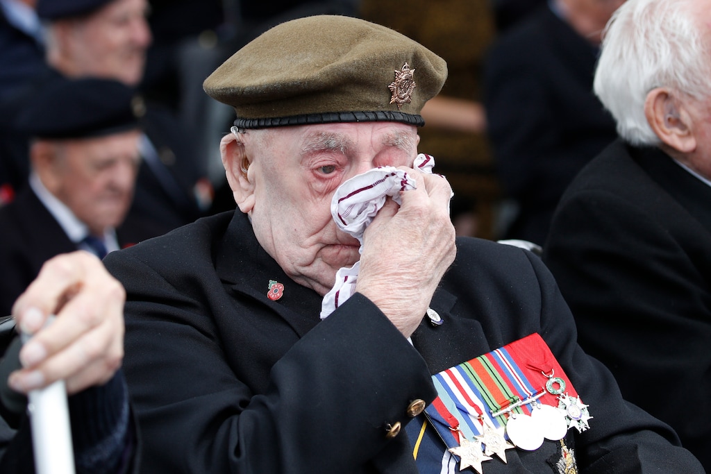 A veteran wipes his eyes during a ceremony to mark the 75th anniversary of D-Day, Wednesday, June 5, 2019, in Portsmouth, England. (AP Photo/Alex Brandon)