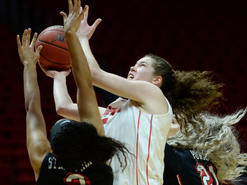 (Francisco Kjolseth  |  The Salt Lake Tribune)  Utah Utes center Megan Huff (5) drives the ball as Utah hosts UNLV in women's NCAA basketball at the Huntsman Center, Thursday, March 15, 2018.