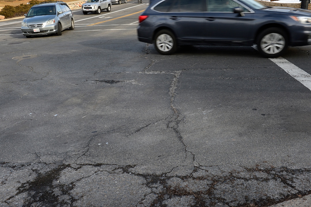 (Scott Sommerdorf   |  The Salt Lake Tribune)   
A section of the damaged road on 100 South just west of University in Salt Lake City, Wednesday, January 24, 2018.