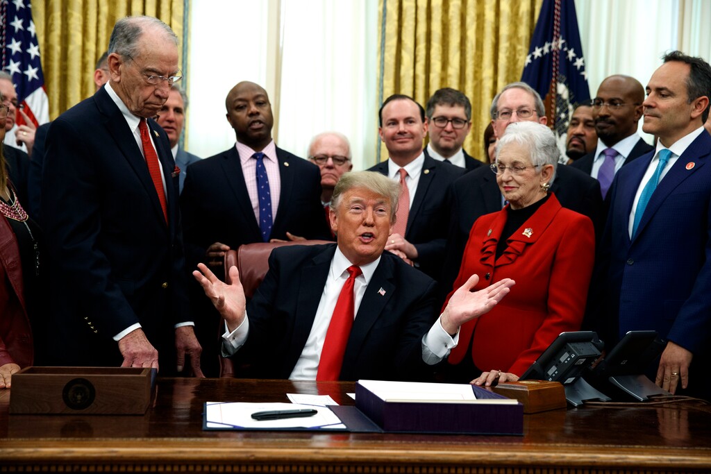 President Donald Trump speaks during a signing ceremony for criminal justice reform legislation in the Oval Office of the White House, Friday, Dec. 21, 2018, in Washington. (AP Photo/Evan Vucci)