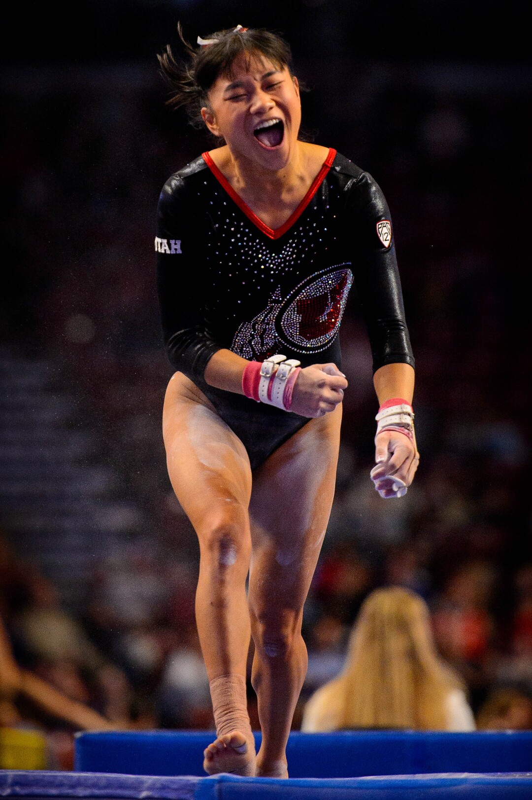 (Trent Nelson  |  The Salt Lake Tribune) Utah's Kim Tessen celebrates a 9.95 on the bars at the Best of Utah NCAA Gymnastics Meet in West Valley City on Saturday, Jan. 11, 2020.