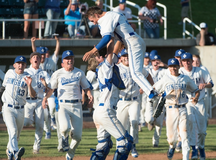 (Rick Egan  |  The Salt Lake Tribune)  The Bingham catcher Camden Snarr picks up pitcher Derek Soffe as the Miners storm the field to celebrate their win over Riverton, in 6A state baseball State  Championship game, at UVU in Orem, Friday, May 25, 2018.