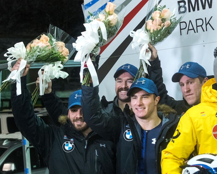 (Rick Egan  |  The Salt Lake Tribune)   The USA team of Codie Bascue, Nathan Weber, Carlo Valdes, and Samuel McGuffie celebrate their 2nd place finished in the BMW IBSF World Cup 4-Man Bobsleigh competition, during the flower ceremony, in Park City, Saturday, November 18, 2017.