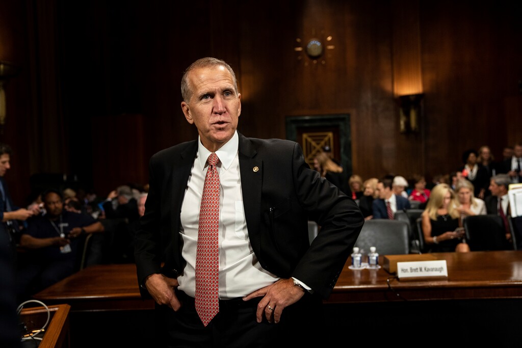FILE - In this Sept. 27, 2018, file photo, Sen.. Thom Tillis, R-N.C., stands during a break in a hearing on Capitol Hill in Washington. Tillis says he’ll vote to block President Donald Trump’s emergency declaration at the border with Mexico, becoming the second Senate Republican to do so. (Erin Schaff/The New York Times via AP, Pool)