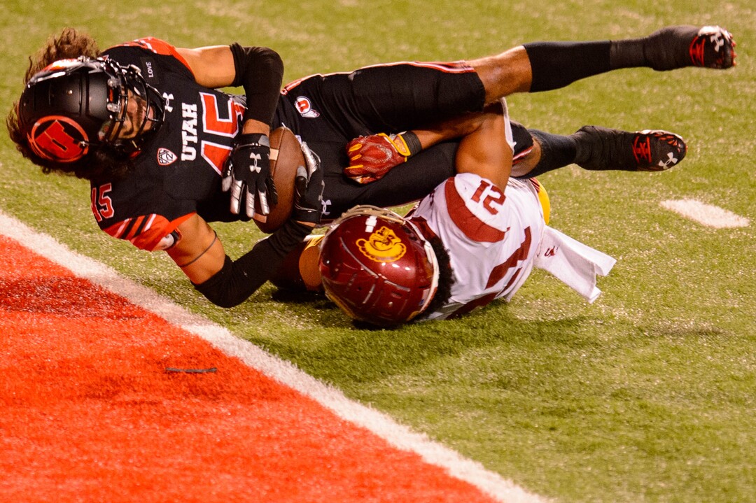 (Trent Nelson  |  The Salt Lake Tribune) Utah Utes wide receiver Samson Nacua (45) scores a touchdown, with USC Trojans safety Isaiah Pola-Mao (21) defending, as the Utah Utes host the USC Trojans, NCAA football at Rice-Eccles Stadium in Salt Lake City on Saturday, Nov. 21, 2020.