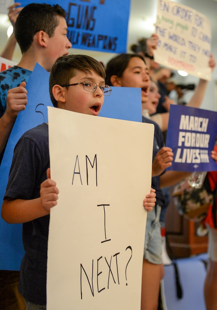 (Chris Samuels | The Salt Lake Tribune) Children stand in front of a rally for increased gun safety measures at the Capitol in Salt Lake City, Saturday, June 11, 2022.