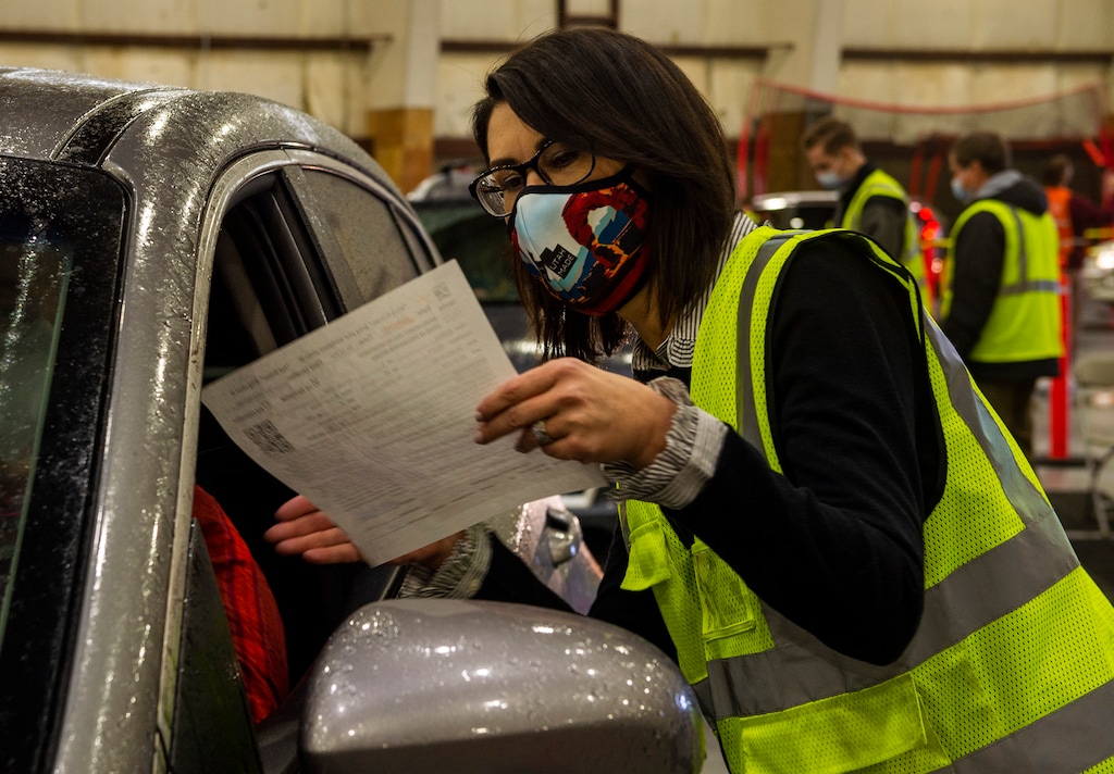 (Rick Egan | The Salt Lake Tribune)   Lt. Gov. Deidre Henderson checks in Davis County residents at the Davis County Health Department COVID-19 clinic at the Legacy Events Center in Farmington, on Thursday, March 11, 2021.