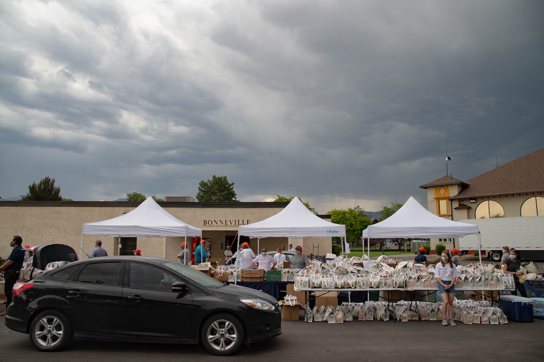(Francisco Kjolseth  |  The Salt Lake Tribune) The third “Miracle Project” for the nonprofit foundation which raises money to purchase food produced by Utah farmers and then gives to residents in need, takes place at the Utah State Fairpark in Salt Lake City on Monday, July 27, 2020. The food donation from the Utah Farm Bureau’s “Farmers Feeding Utah” program provided food for 600 individuals and families who have recently become unemployed due to the coronavirus.