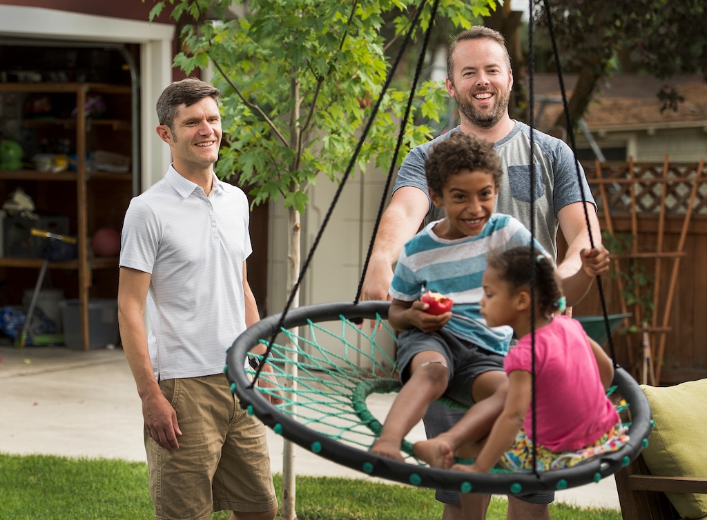 (Leah Hogsten  |  The Salt Lake Tribune)  Brandon Mark and Weston Clark keep their two children Xander, 6, and Zoe, 3, entertained at their home July 25, 2017. Brandon and Weston decided to keep their own last names after the two were married in Utah in 2013 when gay marriage was legal. 