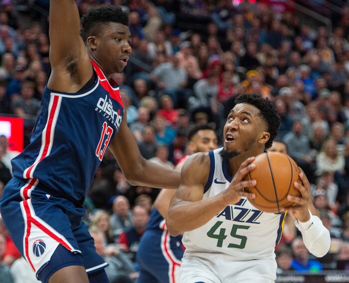 (Rick Egan  |  The Salt Lake Tribune) Utah Jazz guard Donovan Mitchell (45) looks for a shot, as Washington Wizards center Thomas Bryant (13) defends, in NBA action between the Utah Jazz and the Washington Wizards, in Salt Lake City, Friday, February 28, 2020