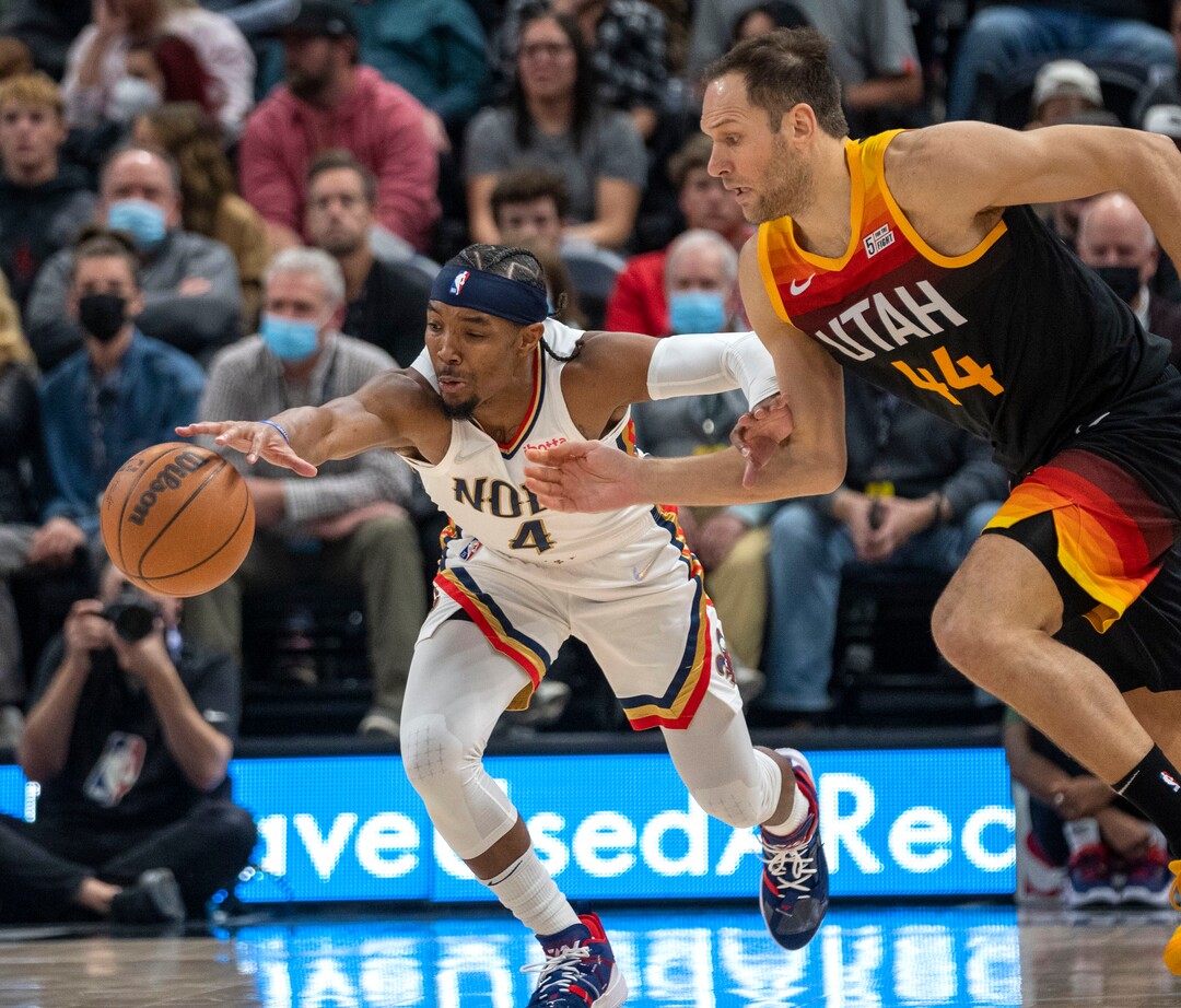 (Rick Egan | The Salt Lake Tribune) New Orleans Pelicans guard Devonte' Graham (4) taps the ball away from Utah Jazz forward Bojan Bogdanovic (44), in NBA action between the Utah Jazz and the New Orleans Pelicans, at Vivint Arena, in Salt Lake City, on Friday, Nov. 26, 2021.