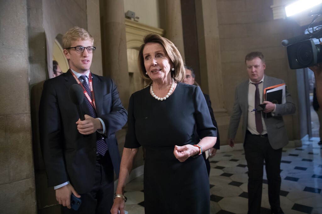 (J. Scott Applewhite | The Associated Press) House Minority Leader Nancy Pelosi, D-Calif., leaves a meeting with Speaker of the House Paul Ryan, R-Wis., and and members of the Congressional Hispanic Caucus, hoping to construct a legislative replacement for former President Obama's Deferred Action for Childhood Arrivals program, at the Capitol in Washington, Wednesday, Sept. 13, 2017.