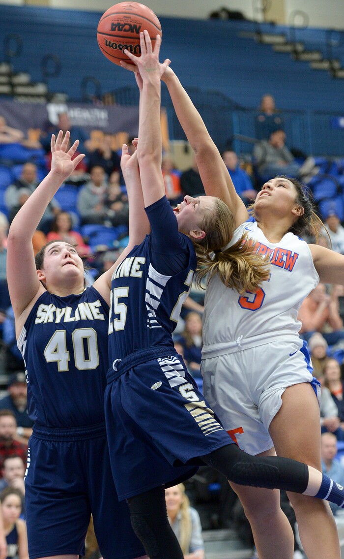 (Leah Hogsten  |  The Salt Lake Tribune)  Skyline's Madison Grange (25) and Timpview's Shalyn Fano (05) fight for the rebound. Timpview faces Skyline in their semifinal game of the 5A High School Girls' Basketball Tournament at SLCC in Taylorsville, Friday, Feb. 23, 2018. 
