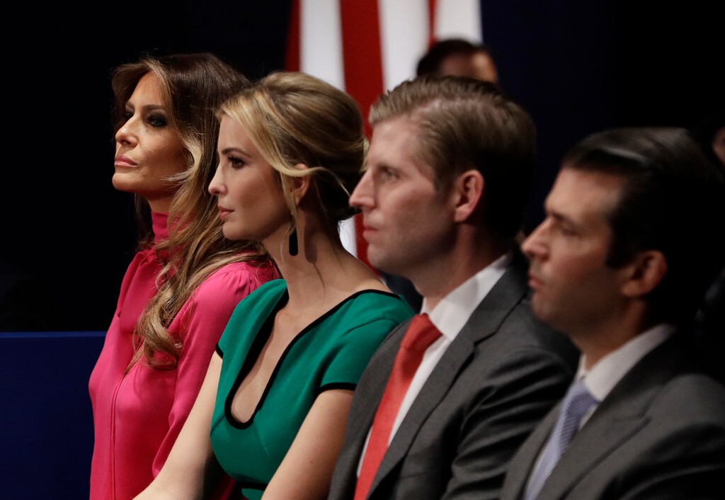 In this Sunday, Oct. 9, 2016 file photo, from left, Melania Trump, Ivanka Trump, Eric Trump and Donald Trump, Jr. wait for the second presidential debate between Donald Trump and Democratic presidential nominee Hillary Clinton at Washington University in St. Louis. President-elect Donald Trump’s children may see his move to the White House as a way to raise money for their favorite causes. Two recent fundraising pitches featuring the incoming first family were meant to benefit charities, but they also raised questions among ethics experts that the Trumps might be inappropriately selling access. (AP Photo/John Locher, File)